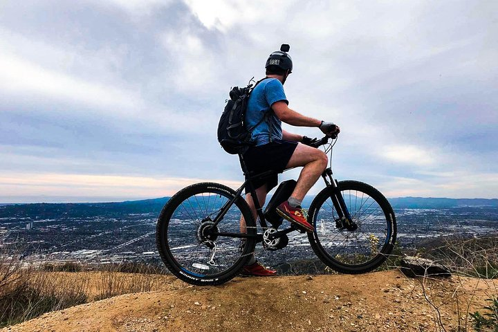 Experience the freedom of electric biking through the scenic Verdugo Mountains where steep trails and breathtaking views of Los Angeles await on your adventurous ride.